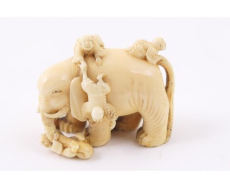 Japanese carved ivory netsuke, Meiji (1868-1912), carved as boys climbing over an elephant, 4.5cm