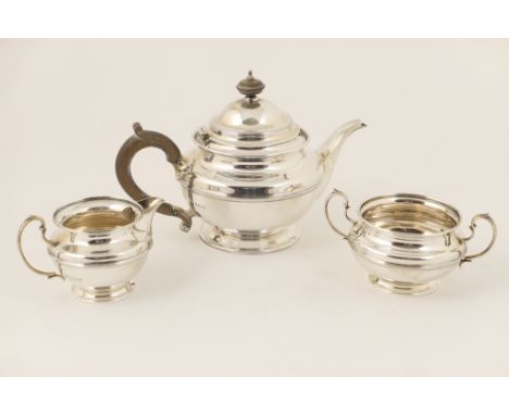 George V silver three piece tea service, by Elkington &amp; Co., Birmingham 1923, comprising teapot, sugar basin and milk jug