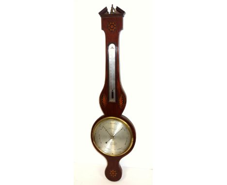 Sheraton style wheel barometer with a silvered dial inscribed "J W Renwick, London" and a thermometer above, in a shell and f