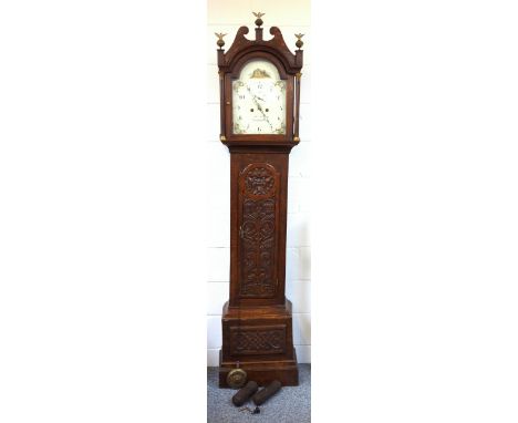 Regency longcase clock with a painted arched inscribed "Wm Kirk Stowmarket", seconds dial, Arabic numerals, and floral spandr