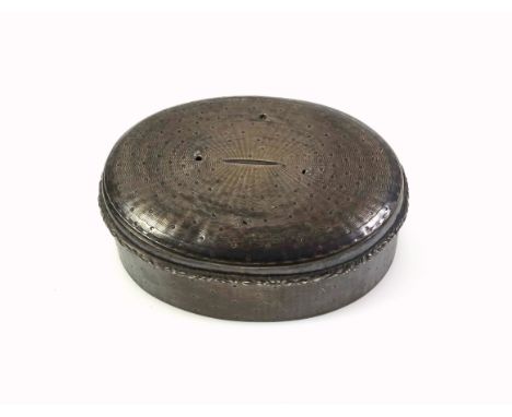 Late 19th Century French silver oval music box with engine turned decoration, the hinged cover with foliate rim, gilt and lea