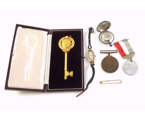 9ct gold tie pin, inscribed "P J C", 1.5grs; 9ct lady's wristwatch, gross 5.9grs without movement; silver gilt presentation k