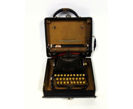 Early 20th Century Corona portable folding typewriter, with a QWERTY keyboard typing 82 characters, in original carrying case