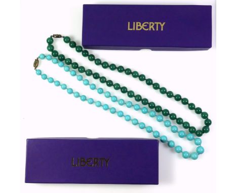 A turquoise necklace with a gilt white metal clasp stamped silver, length 65.5cm, the beads are graduated from 1cm to 1.3cm a