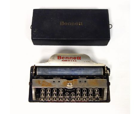 Early 20th Century American Bennett portable typewriter with an AZERTY (French) keyboard typing 84 characters, with black cov