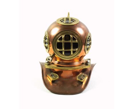 A miniature copper and brass diving helmet shop display, used by Rolex to advertise their Submariner watch circa 1970's, 18.5