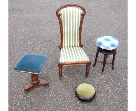 Victorian carved rosewood nursing chair, upholstered in floral green stripe fabric, on turned tapering legs and brass castors