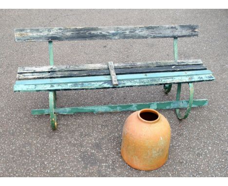 Wrought iron garden bench with weathered painted teak slats, on scroll legs, W.173cm, and a terracotta rhubarb forcer, H.40cm