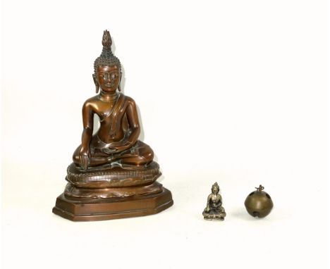 Thai bronze figure of a seated buddha, in the "Calling The Earth To Witness" position, with a flame ushnisha on its head, sea