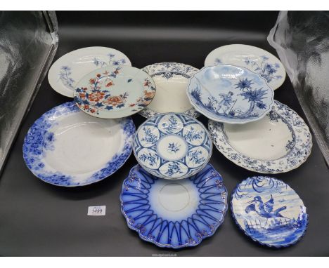 A small quantity of plates, some a/f, with staple repairs including Royal Worcester bowls and a Japanese porcelain dish.