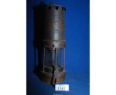 A Davy lamp marked 'Thomas &amp; William, Aberdare, type no 1, no 760.