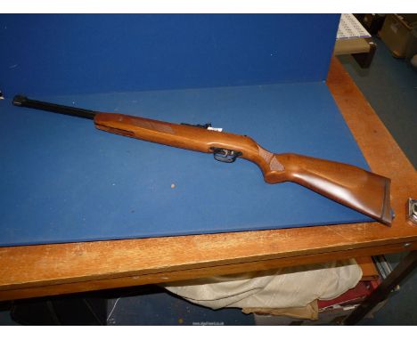 A Weihrauch HW57 spring-powered, under lever cocking .22 / 5.5 mm calibre air rifle, with scope mounting grooves, self openin