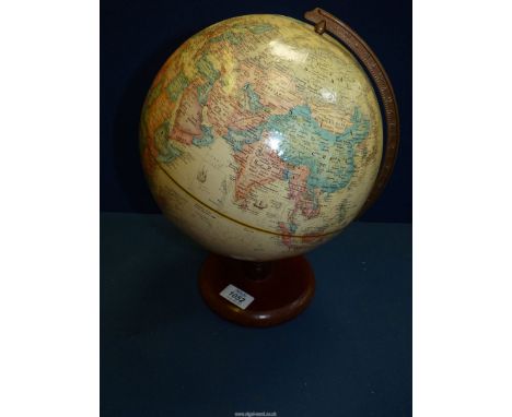 A World classic globe on a wooden stand, 9'' diameter.