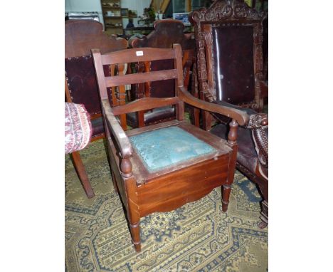 A Mahogany framed Ladderback Commode Chair standing on turned front legs, furnished.