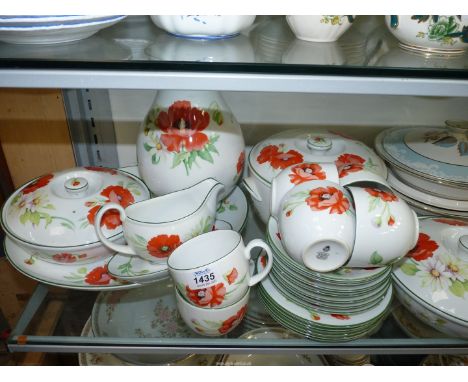 A large quantity of Royal Worcester 'Poppy' pattern to include cups and saucers and side plates, three lidded tureens, a meat