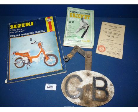 A Haynes Suzuki Workshop Manual, metal AA - G.B. sign, certificate for motor vehicle 1958 and Cricket Annual 1974.