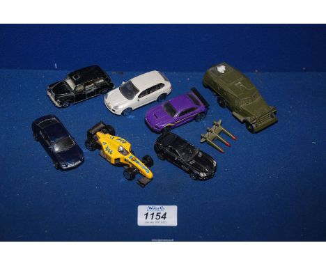 A small quantity of toy cars including Corgi London taxi, army jeep, Fastlane purple car, etc.