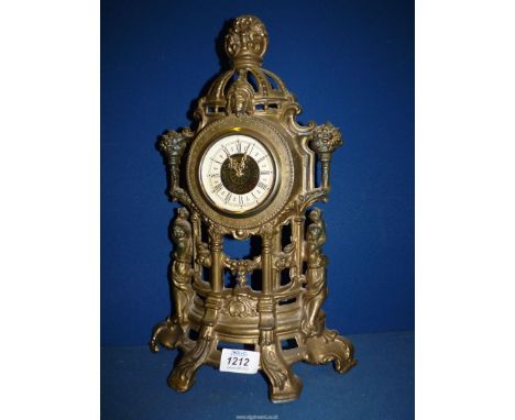 An ornate brass effect Mantle clock, 16" tall.