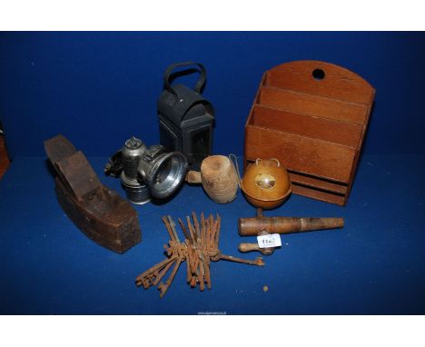 A quantity of miscellanea including old railway lamp with candle, Treen plane and letter rack, Lucas carbide lamp, a bunch of