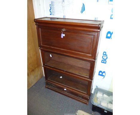 A Globe Wernicke type Mahogany bookcase having an upper bureau section with pigeon holes, two bookcase tiers below and a full