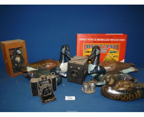 A quantity of miscellanea including wooden ducks, Nagel Vollenda film camera, Hawkeye-Major camera, wooden cased microscope e