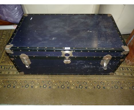 A black hardboard Trunk, with metal fasteners, 20" x 14" x 36" long.