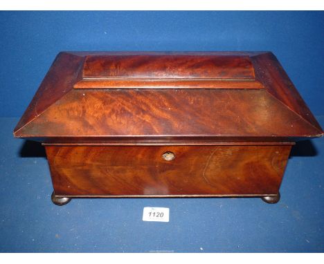 A Victorian flame mahogany Tea Caddy with complete interior fittings (centre bowl has a crack and its lid has a small chip to
