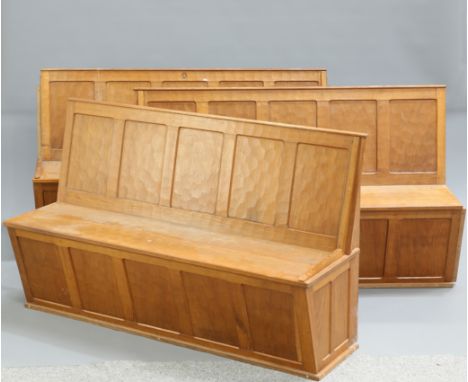 ALAN GRAINGER&nbsp;
AN ACORNMAN OAK PEW, of three five panel sections, adzed to all visible areas, carved acorn signature. 47