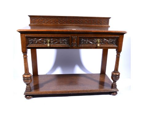 Oak dining room suite, comprising a dresser, with a two-shelf Delft rack, the base section with two drawers over two panelled