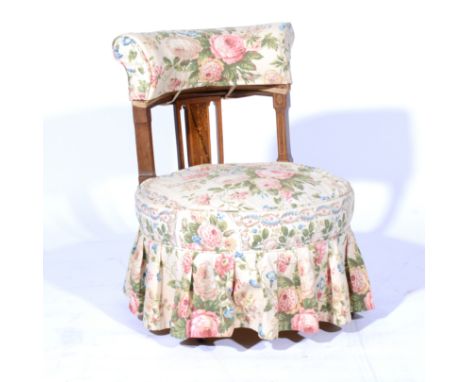 Edwardian inlaid rosewood nursing chair,  cotton-print loose covers, circular seat, height 72cms.