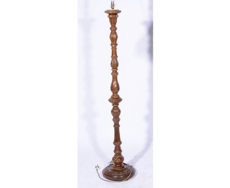 Carved and turned walnut standard lamp, with shade, 183cm as fitted.