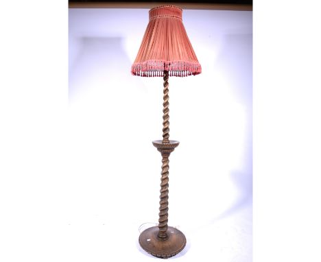 Oak standard lamp,  barley twist column, circular base, with shade, 185cms overall.