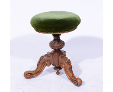 Victorian stained walnut adjustable piano stool, circular seat, carved tripod legs, diameter 35cms. 