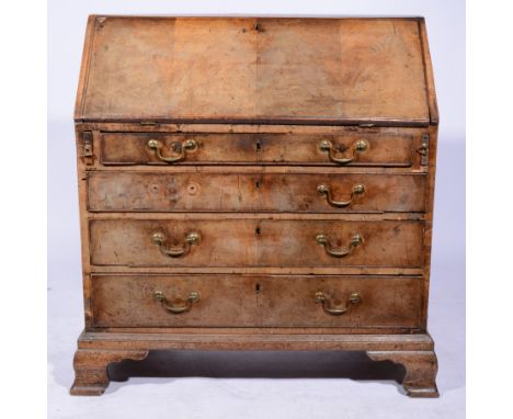 George II mahogany fall front bureau, the fitted interior having a central cupboard, small drawers and pigeon holes, above fo