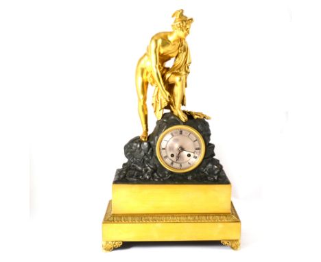 French gilt metal and bronzed mantel clock, modelled with Mercury tying his sandal, silvered dial, movement striking on a bel