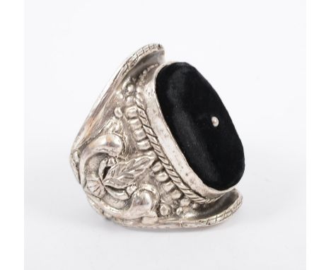 A large pin cushion cuff bangle, white metal with oval black velvet cushion with central bead embellishment, 8cm wide, marked