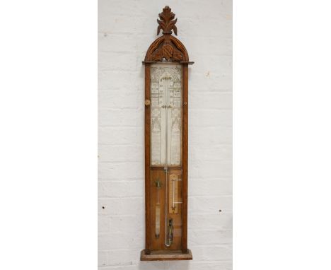 Admiral Fitzgerald oak cased barometer, arched top, printed chart, 117cms.