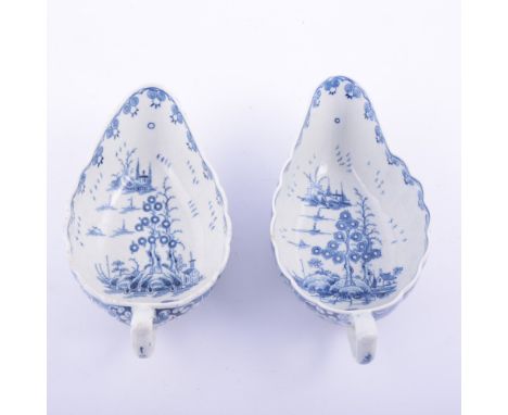 Near pair of First Period Worcester porcelain blue and white sauceboats, The Doughnut Tree pattern, 1775-80, of fluted form, 