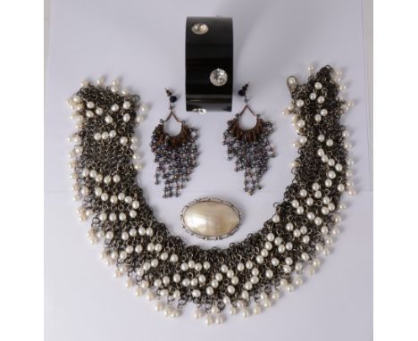 A vintage chain mail collar, 6cm wide with multiple cultured pearls, 43cm long, an oval mother-of-pearl brooch 55mm x 35mm, a