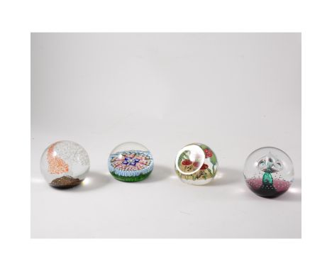 Seven late 20th century glass paperweights, including Caithness, Zellique and R P Golding.
