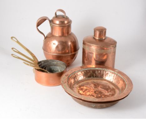 A collection of copper wares, a copper kettle, coal scuttle, dishes, tea caddy, set of five small milk/sauce pans, Jersey cre