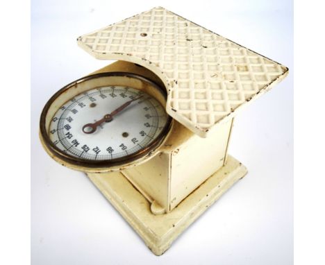 A set of early 20th century possibly German painted cast iron bathroom scales with circular enamel dial, height 21.5cm.