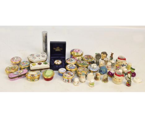 A collection of Halcyon Days enamel predominantly Christmas related trinket boxes, boxed, also Limoges examples, and a collec