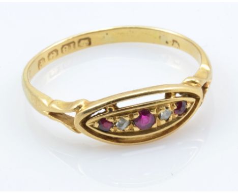 An 18ct yellow gold ruby and diamond five stone dress ring, the central larger ruby flanked by two small diamonds and two sma