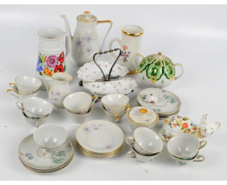 A Weiss Wasser porcelain Art Deco style coffee set, a further floral transfer decorated set of seven cups and saucers, an Ayn