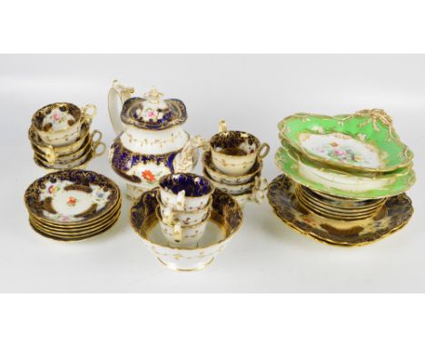 A 19th century part tea service, on blue ground with gilt and floral decoration, with three further green and gilt floral dec