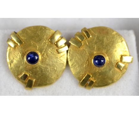 A pair of 18ct yellow gold Modernist disc clip back earrings set with cabochon sapphire, stamped 750, diameter 1.5cm, approx 