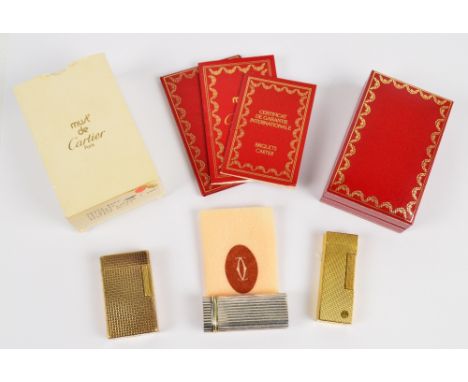 A Must de Cartier boxed briquet lighter with international warranty certificate, number E12324 also Dupont & Dunhill gold pla