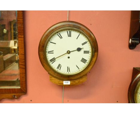 A late 19th/early 20th century oak circular fusee thirty hour wall clock, the circular enamel dial etched with Roman numerals