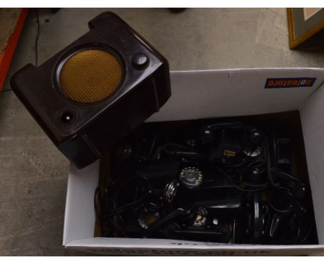 A collection of ten vintage black telephones in various states of disrepair and a brown bakelite radio (11).